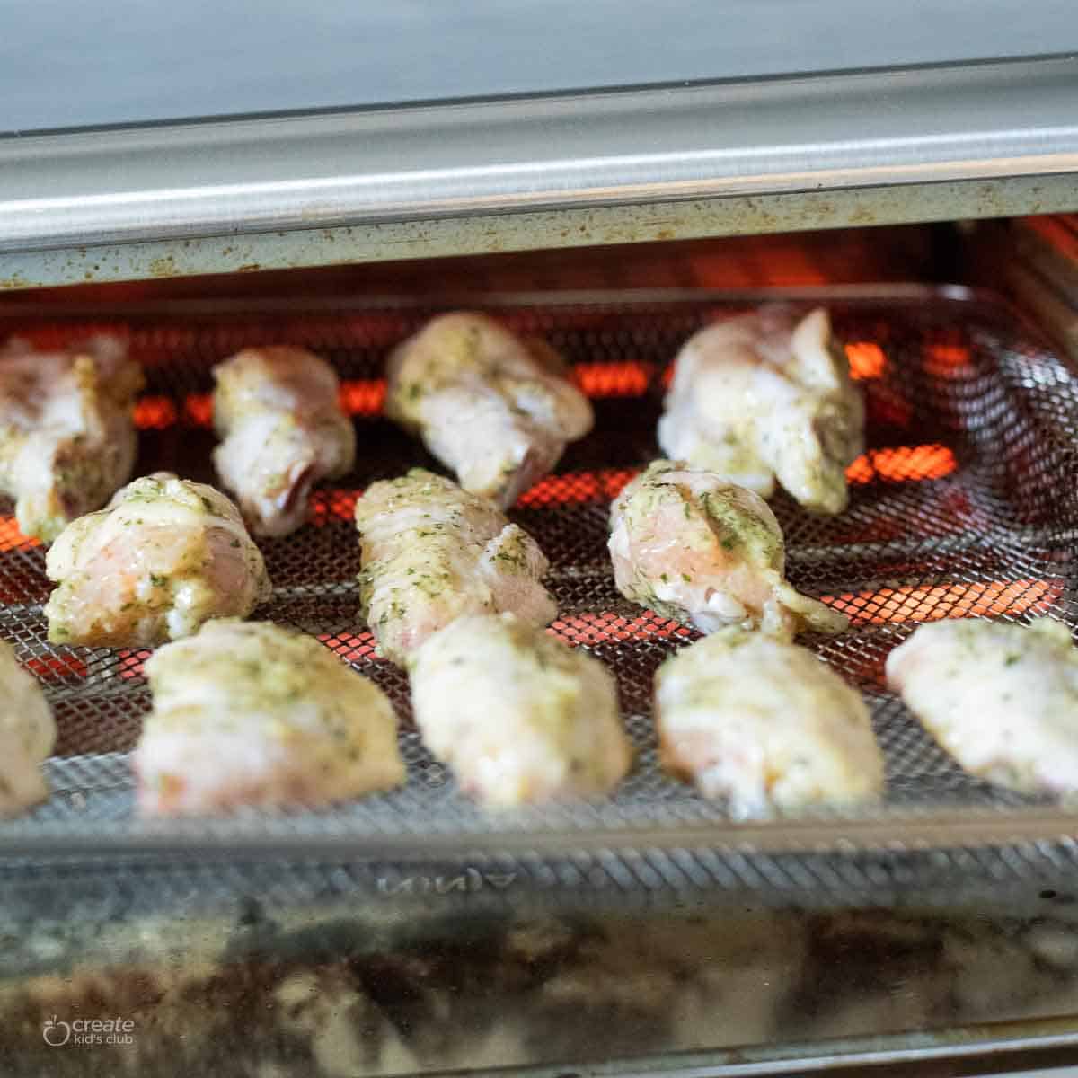 raw chicken wings placed into air fryer