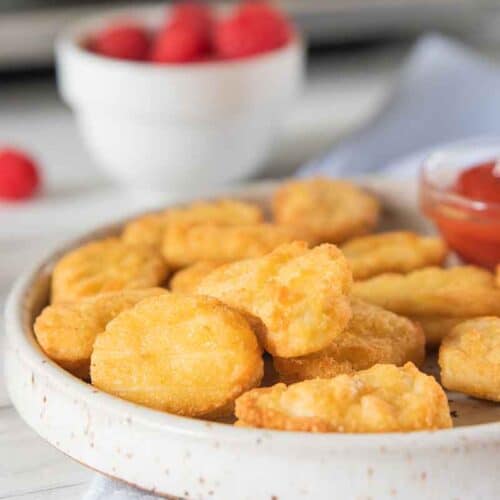 gluten free chicken nuggets on plate with sauce