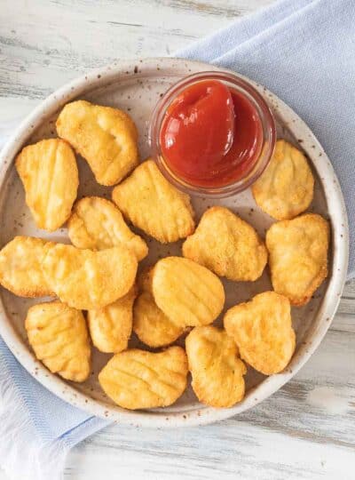 chicken nuggets on plate with dipping sauce