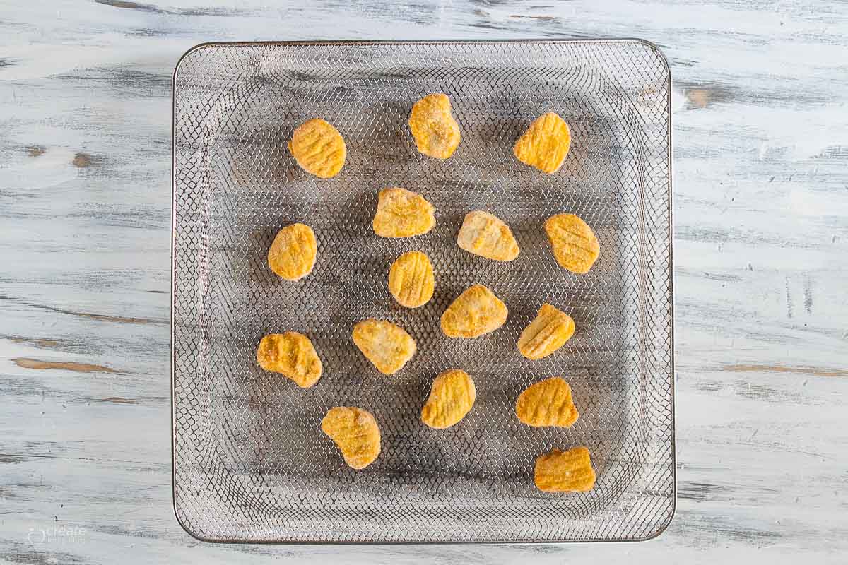 frozen chicken nuggets on air fryer tray