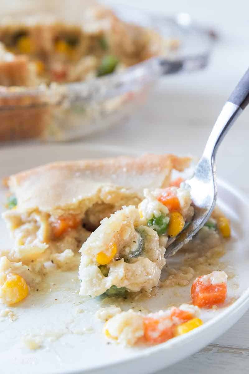 fork scooping bite of chicken pot pie