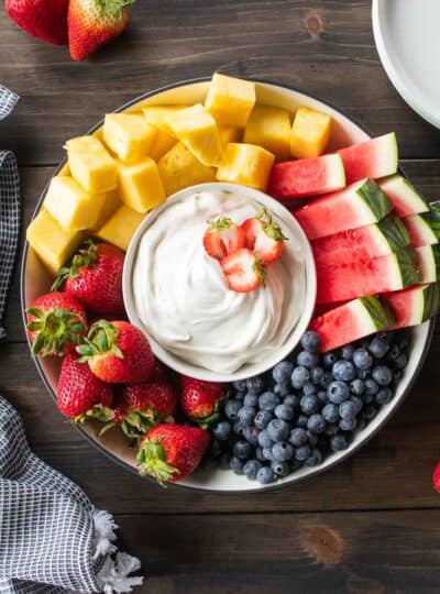 fresh fruit platter with fruit dip in the center
