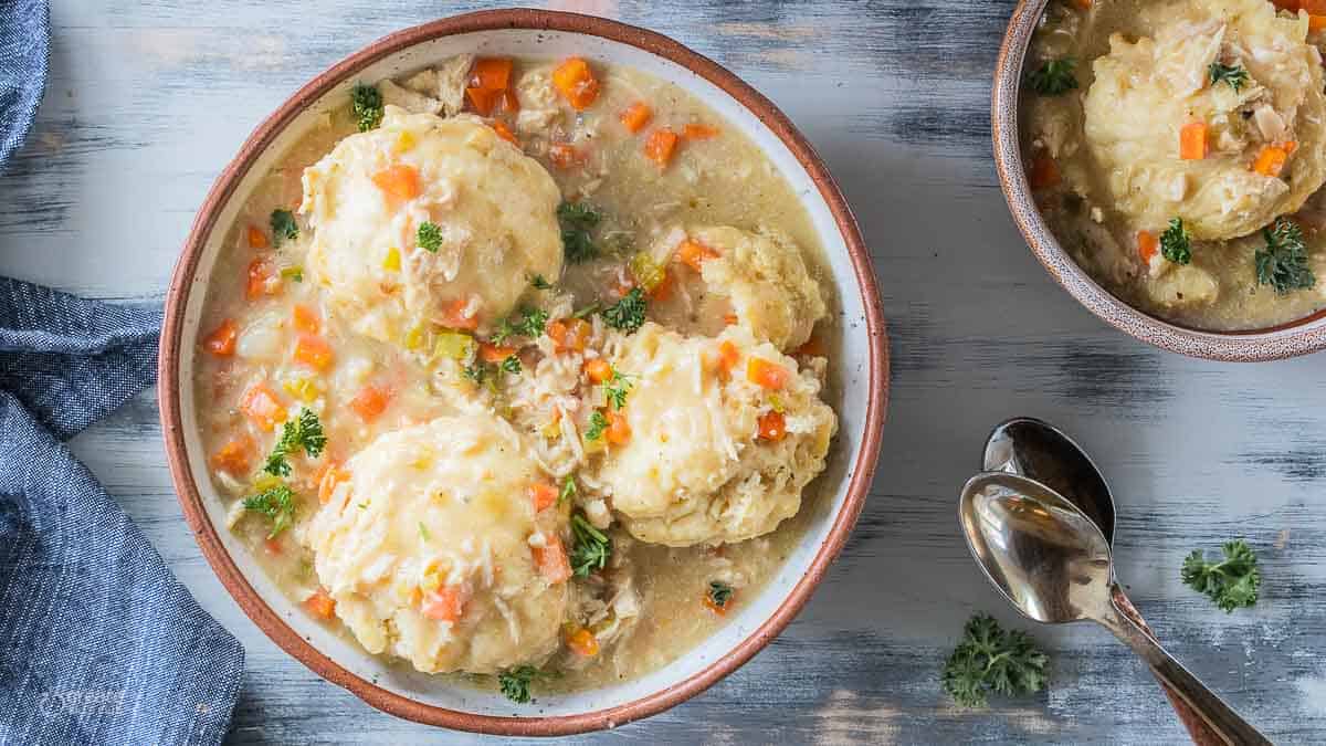 top view of chicken and dumplings in soup bowls