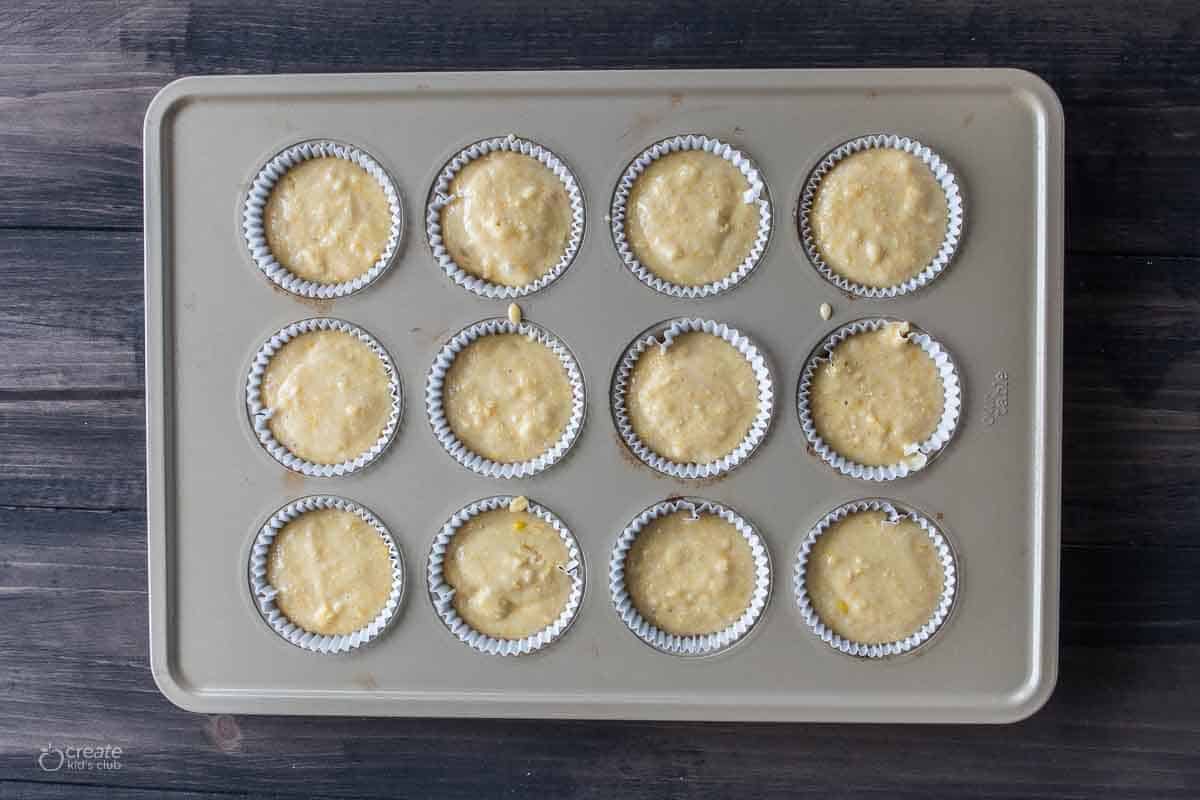 corn bread muffin batter in muffin tin