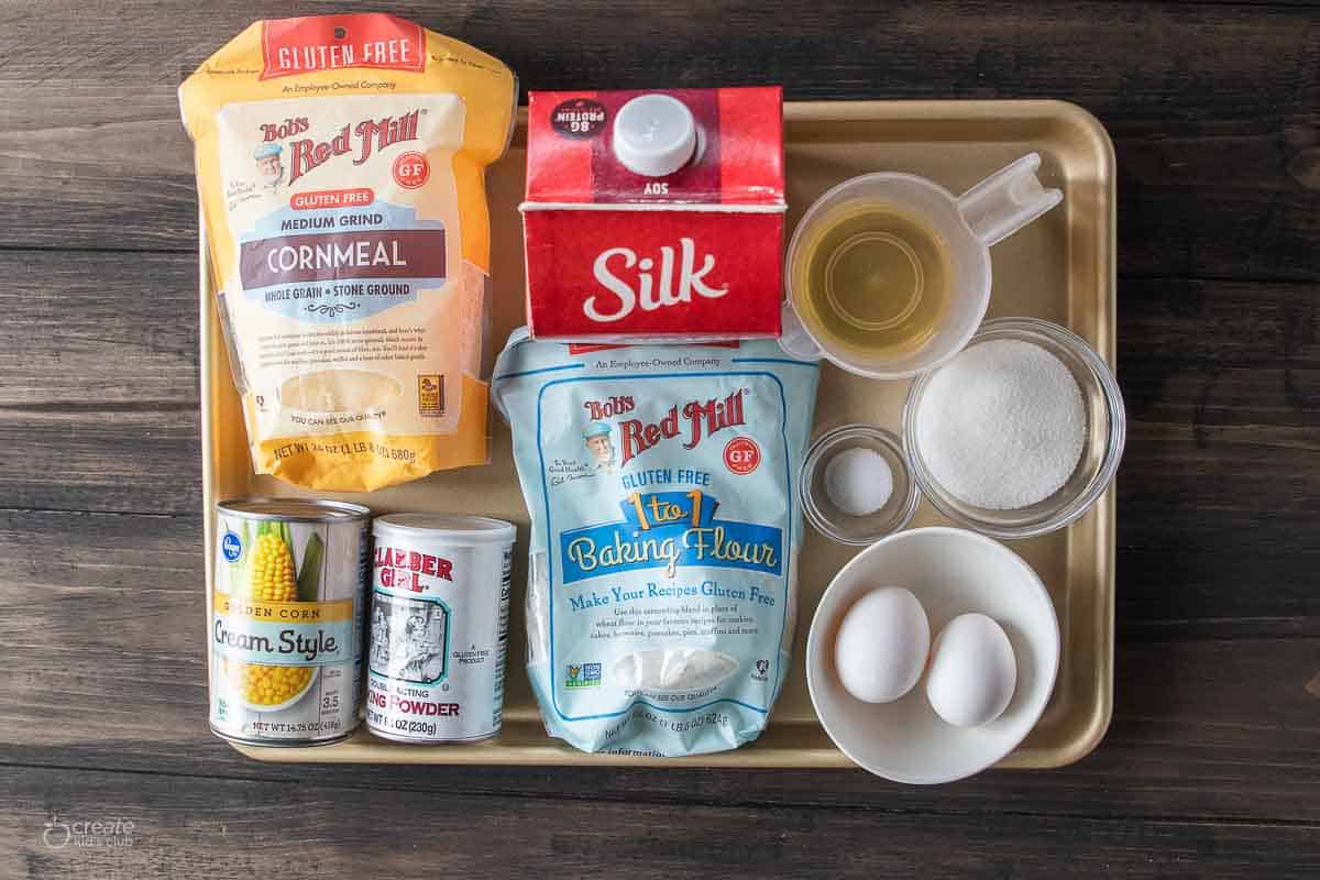 ingredients for gluten free corn bread muffins on sheet pan