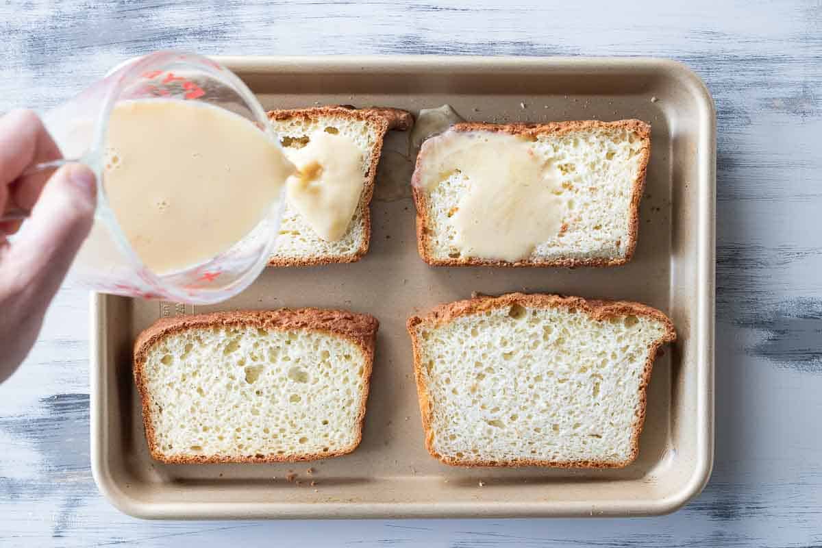 egg and milk mixture poured over slices of gluten free bread