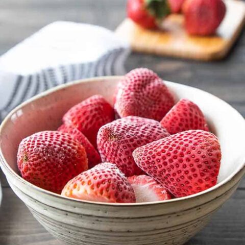 whole frozen strawberries in bowl
