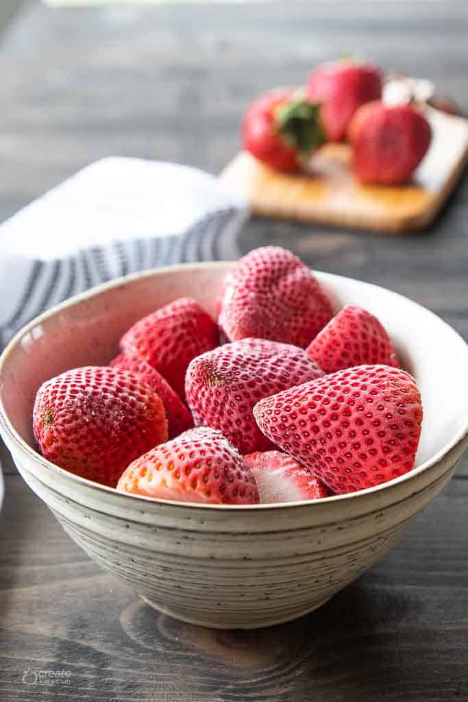 whole frozen strawberries in bowl