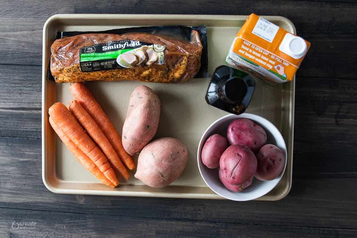 ingredients for instant pot pork roast with vegetables on sheet pan