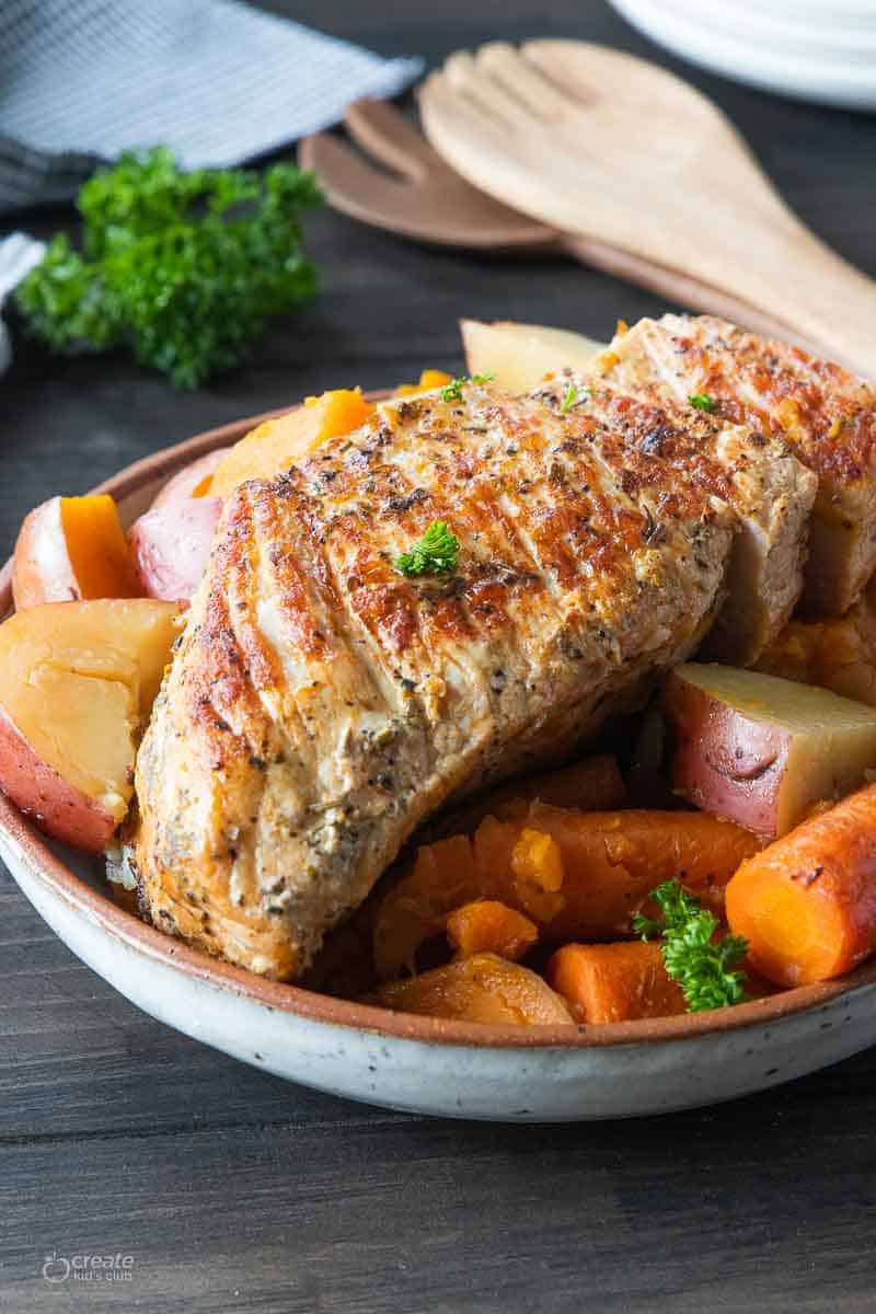 side view of instant pot pork roast with vegetables