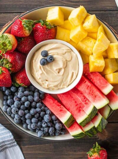 caramel fruit dip in center of fruit platter