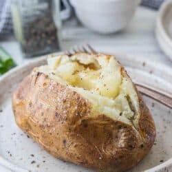 air fried baked potato topped with salt and butter