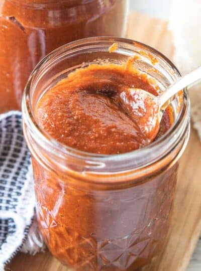 close up of enchilada sauce in mason jar