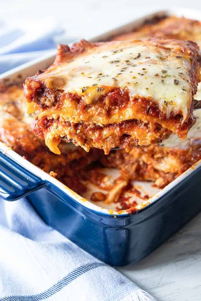 slice of gluten free lasagna removed from baking dish