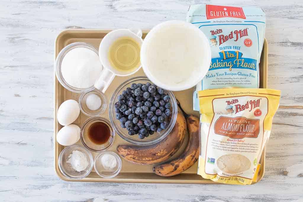 ingredients for gluten free blueberry muffins on baking sheet