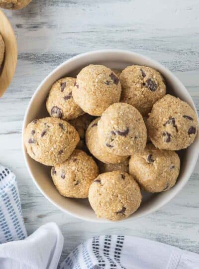 no bake cookie dough bites stacked in a bowl