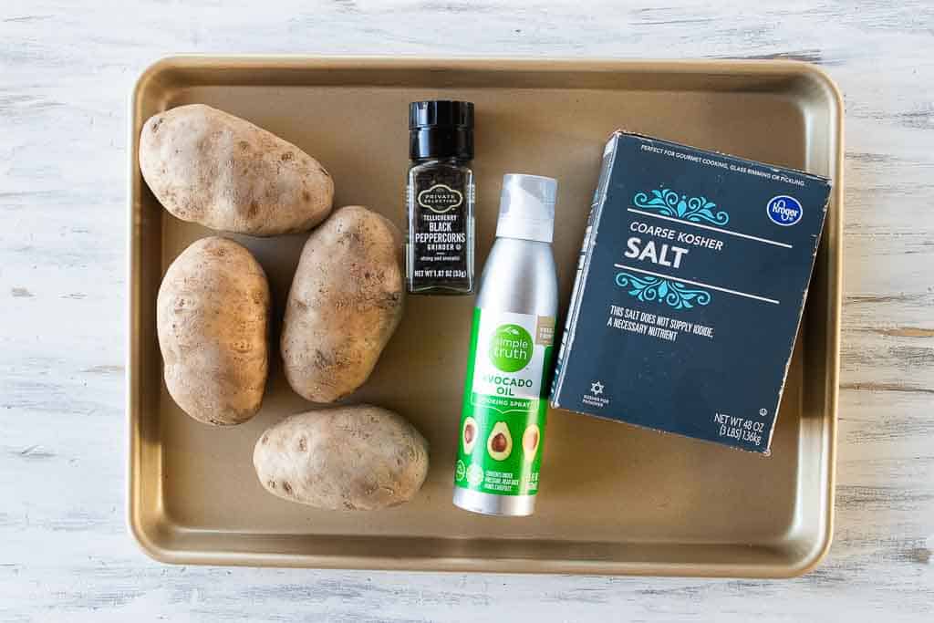ingredients for steakhouse baked potato on sheet pan