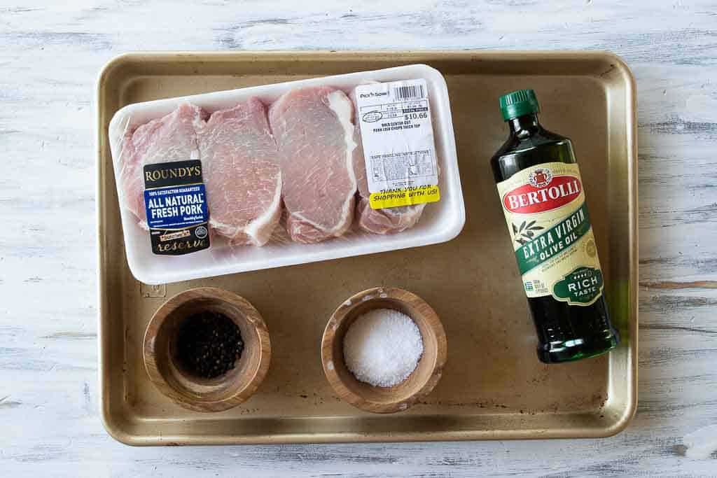 ingredients for baked pork chops on a sheet pan