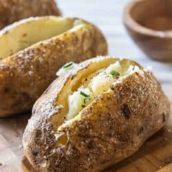 baked potatoes with butter, salt and chives