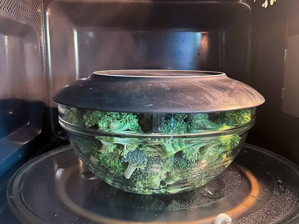 broccoli florets in bowl in microwave