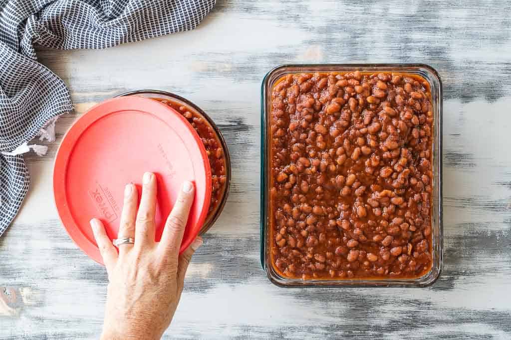 lid placed on top of pyrex dish filled with baked beans