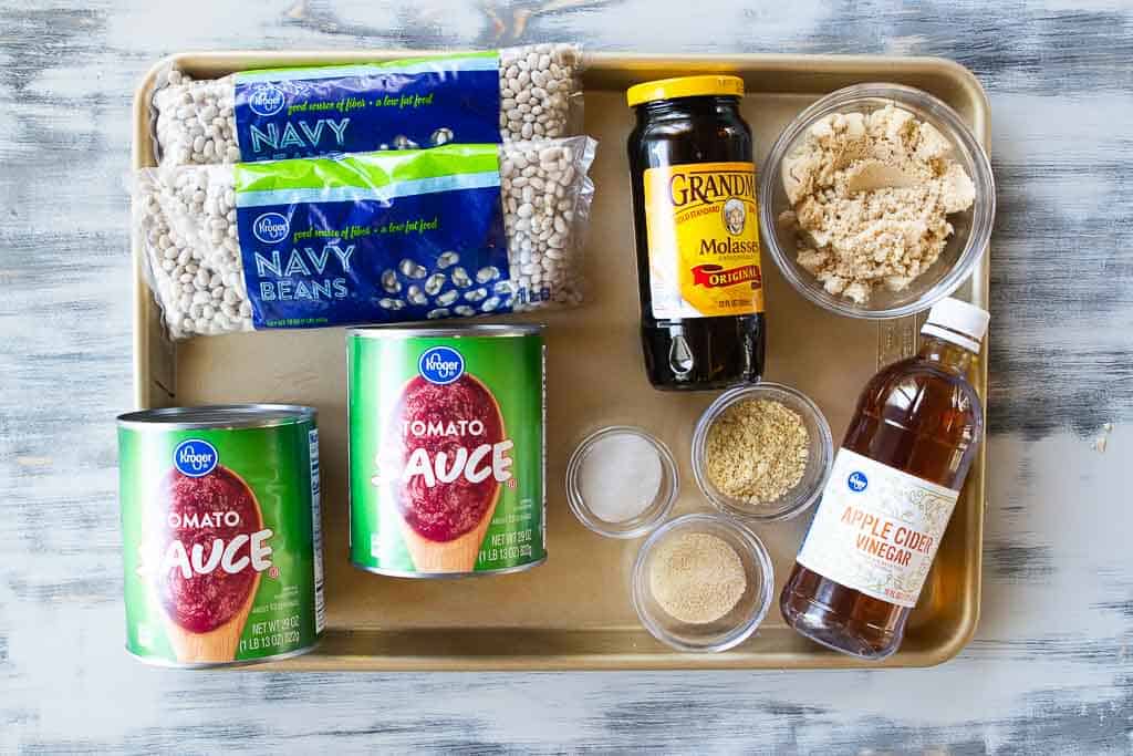 ingredients for crockpot baked beans on a sheet pan