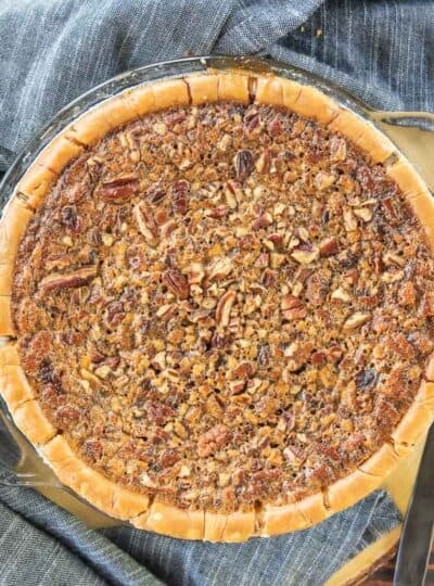A top down view of a pecan pie with gluten free crust.