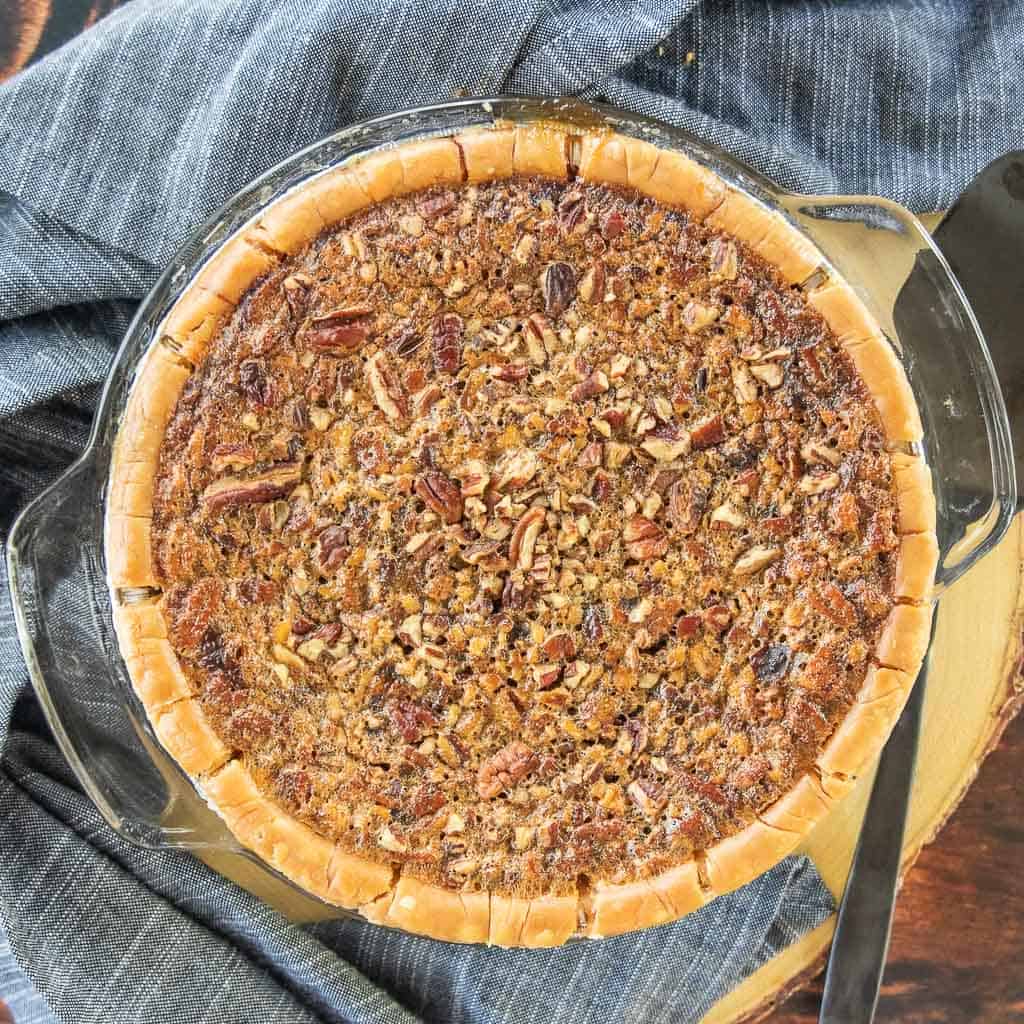 A top down view of a pecan pie with gluten free crust.