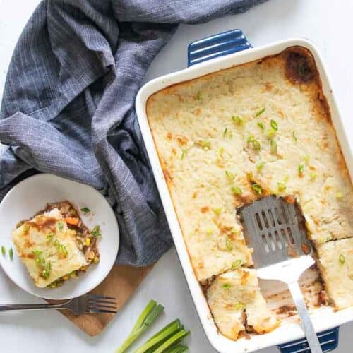Top down pictures of a gluten free Shepards pie with a slice on a plate next to the casserole pan.