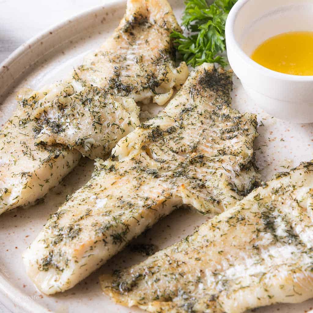 broiled haddock on serving plate