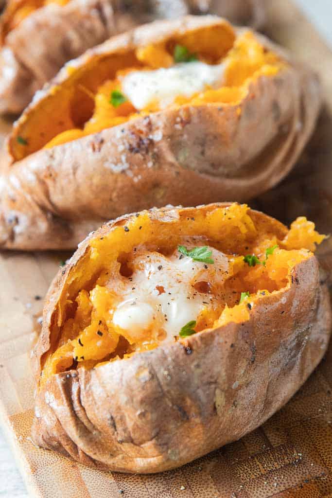 sweet potato topped with seasoning and butter