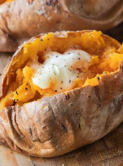 sweet potato topped with seasoning and butter