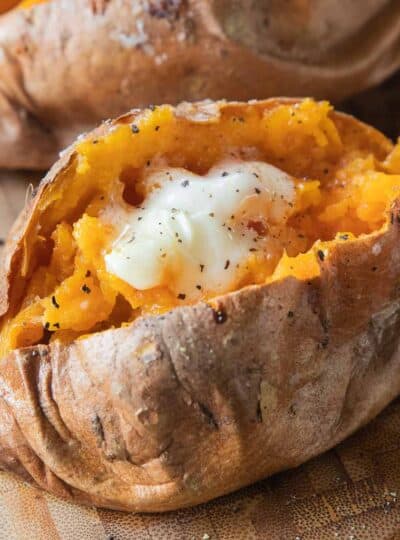 sweet potato topped with seasoning and butter