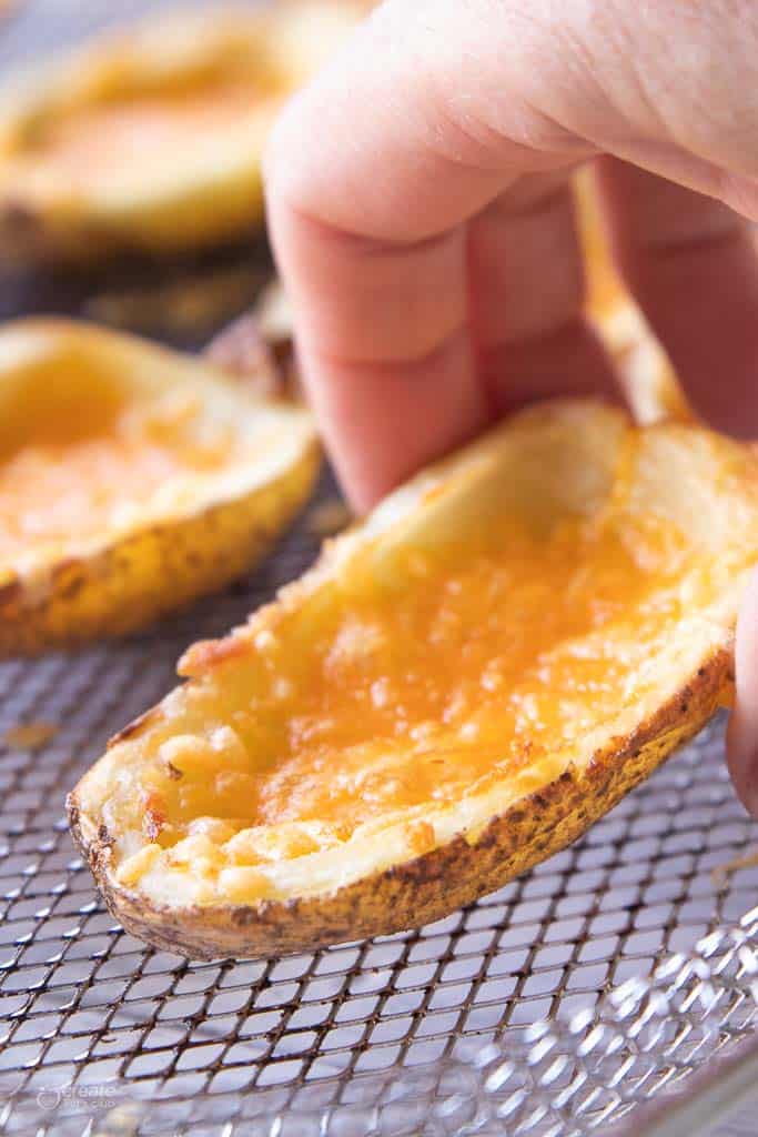 hand holding air fryer potato skin