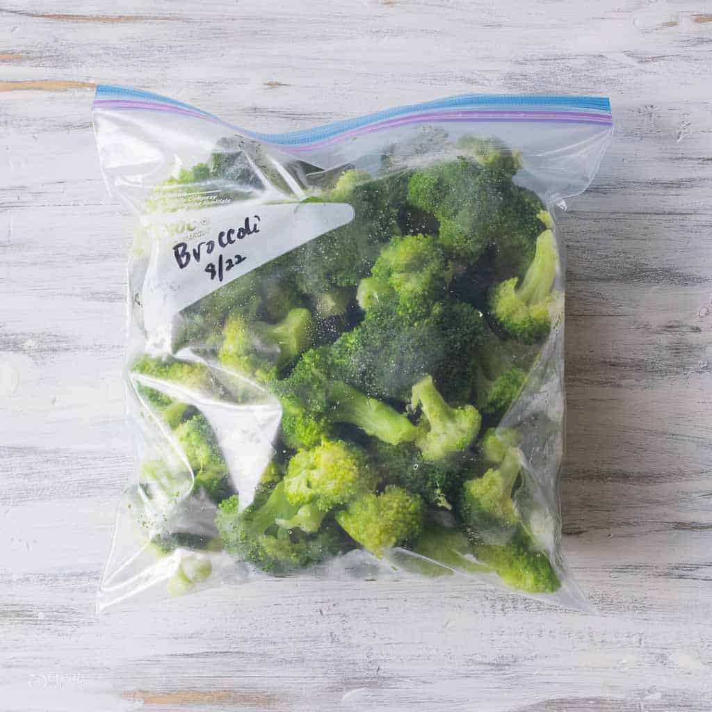 fresh broccoli florets in labeled Ziplock bag
