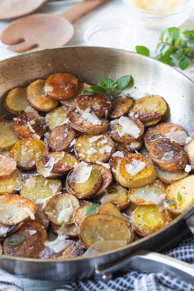 side view of pan-fried potatoes with parmesan