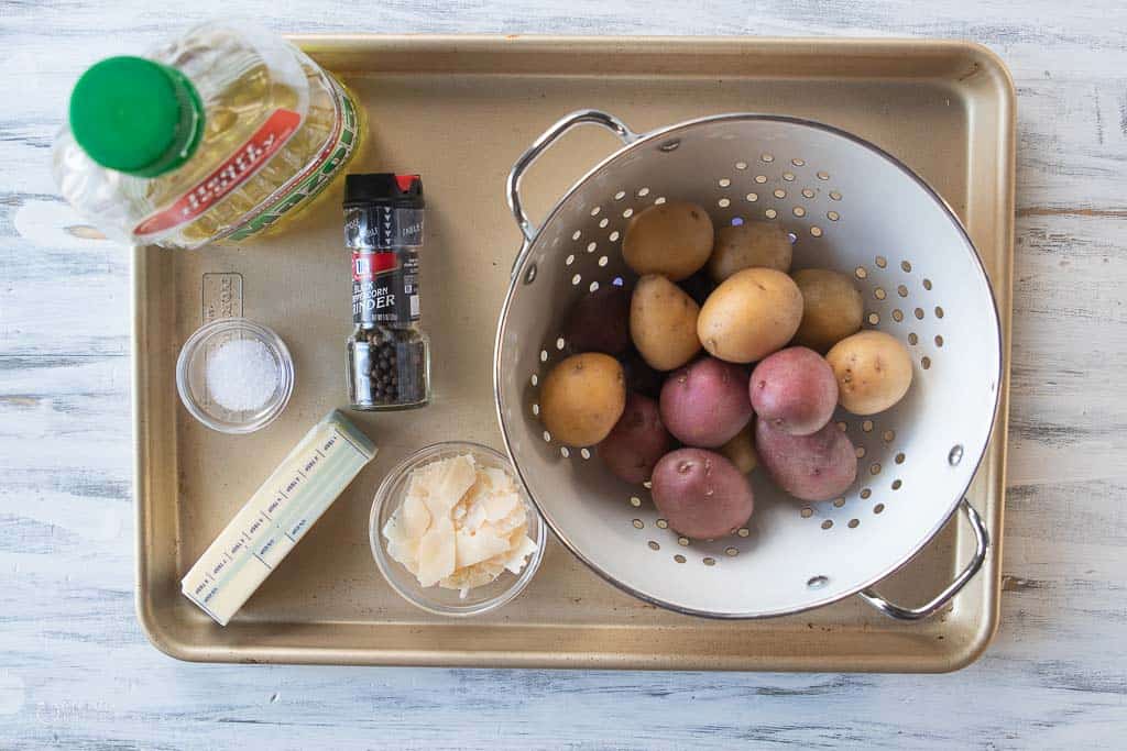 ingredients for pan fried sliced potatoes on sheet pan