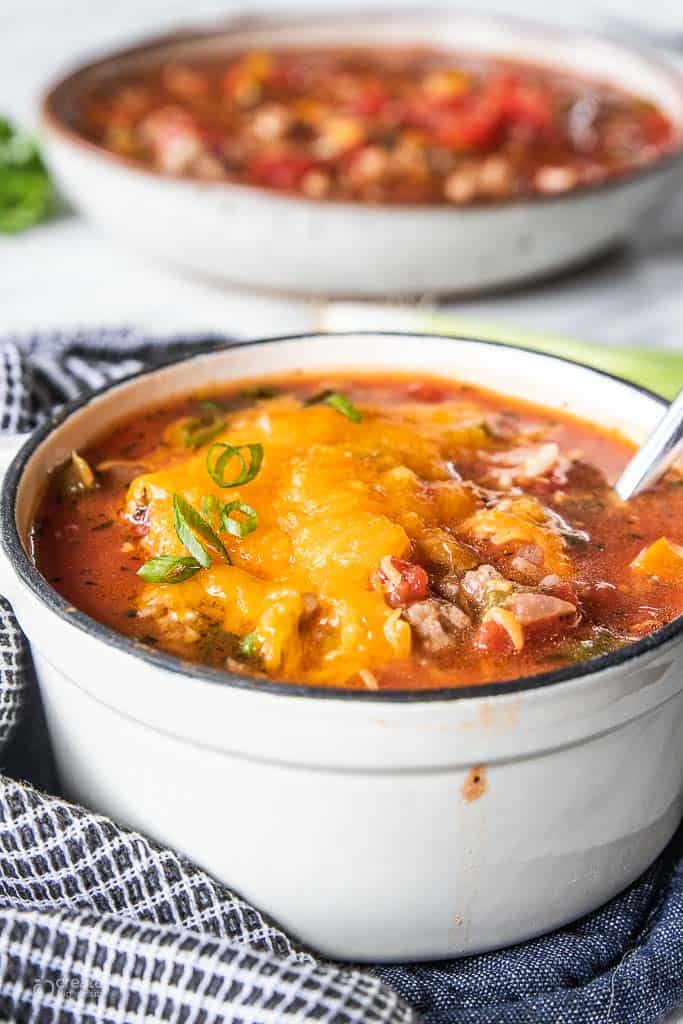 stuffed pepper soup topped with cheddar cheese