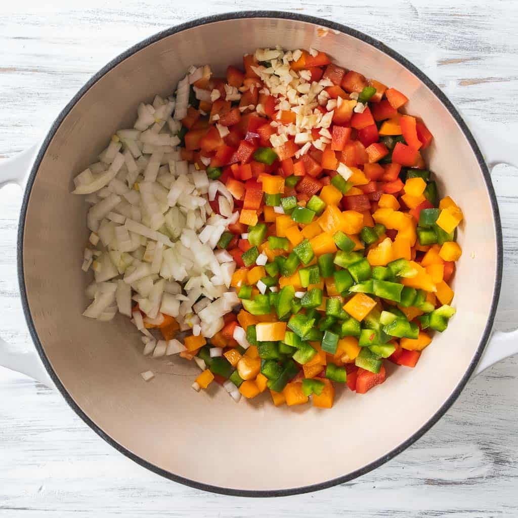 chopped vegetables in dutch oven pot