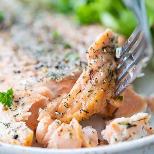 fork scooping a bite of air fried salmon