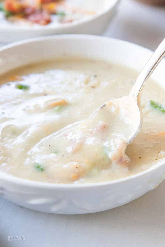 instant pot loaded potato soup in bowl with spoon