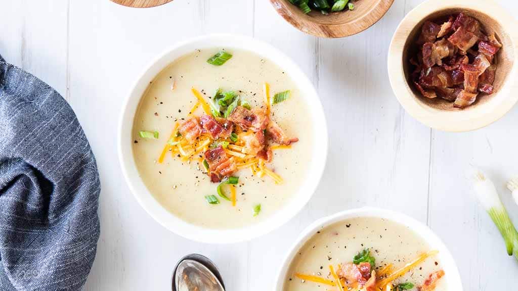 top down view of loaded potato soup in bowls