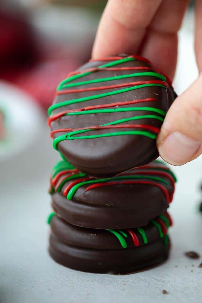 hand holding chocolate covered Oreo