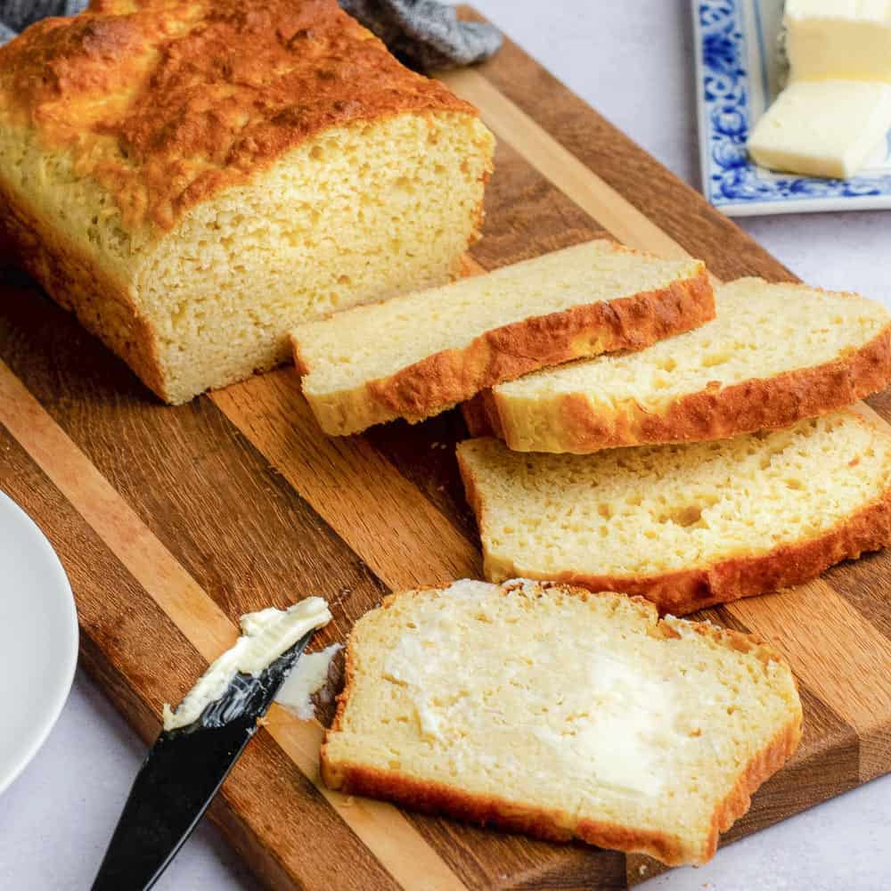 slice of gluten free bread spread with butter