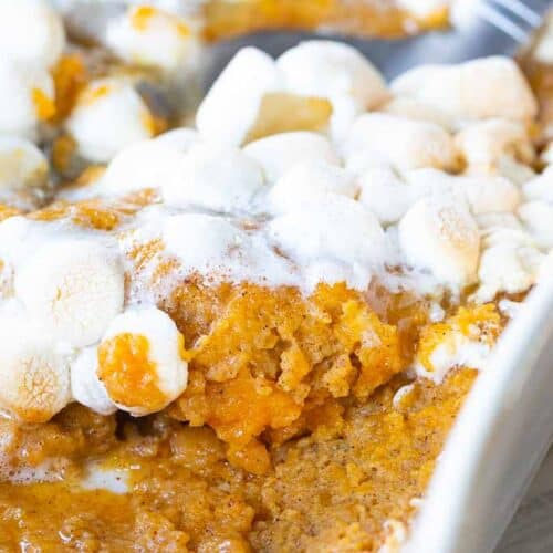 spoon scooping a serving of sweet potato casserole