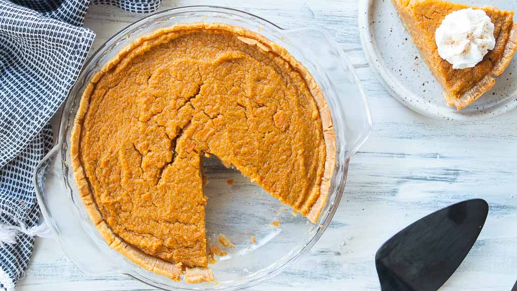 slice of sweet potato pie removed from pie pan