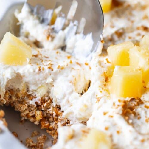 spoon scooping into pineapple pretzel salad