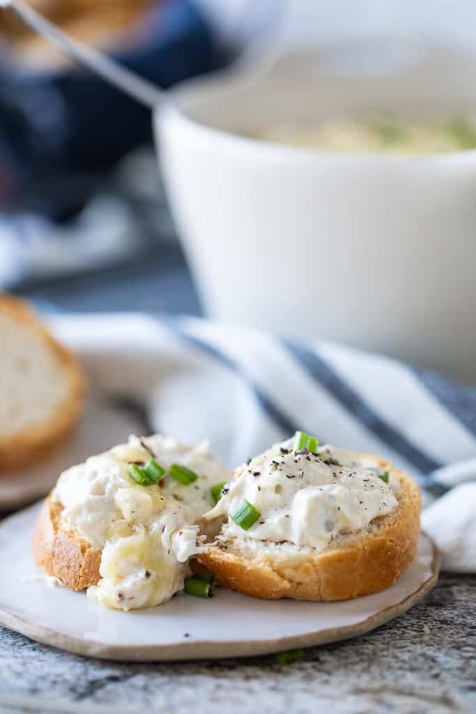 crab artichoke dip on gluten free crostini