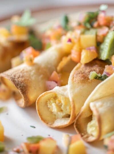 close up view of air fryer taquitos