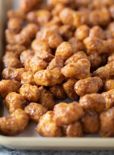 caramel puff corn on baking sheet